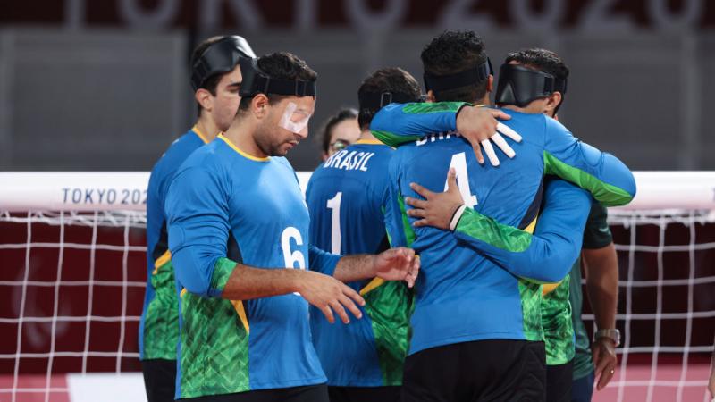 Brazil goalball players hugging on the court