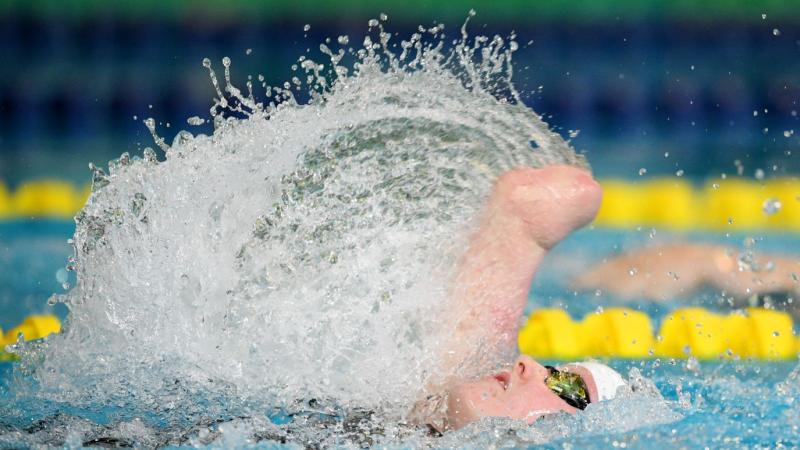 An armless female swimmer in a competition