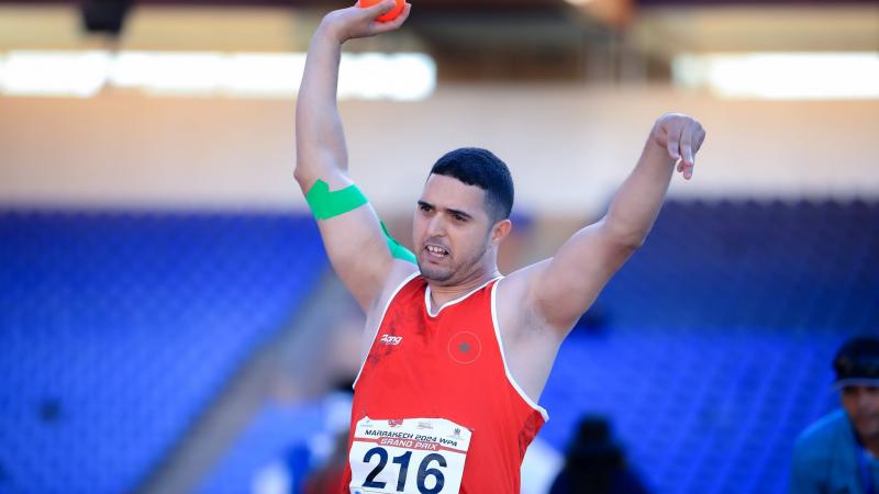 A shot putter in action