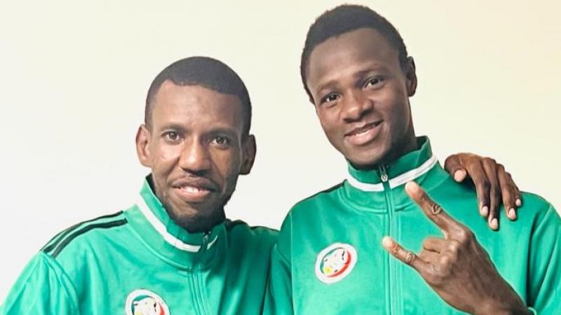 Idrissa Keita, a Para taekwondo athlete from Senegal, and his coach pose for a photograph