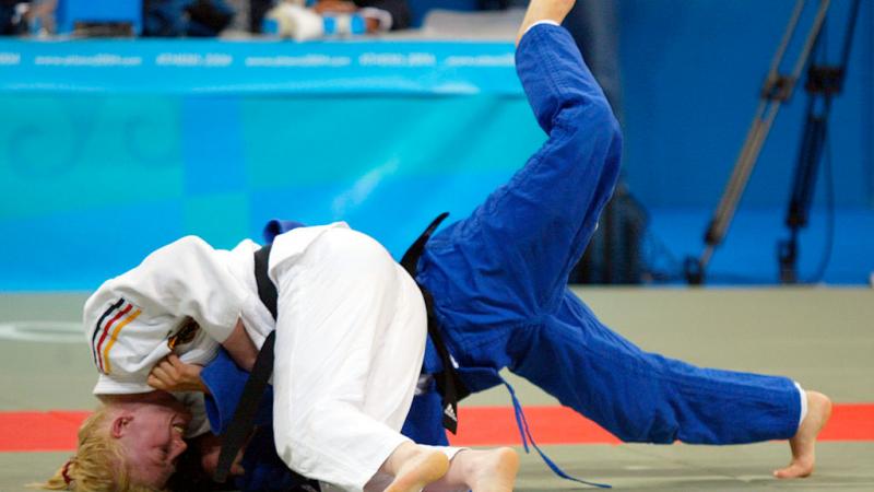 Two female judo athletes in action at Athens 2008.