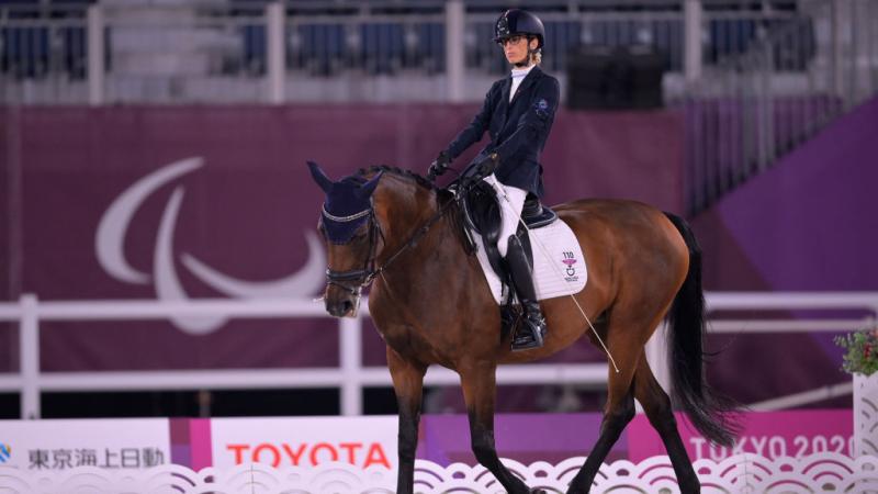 Female Para rider Sara Morganti riding her horse 