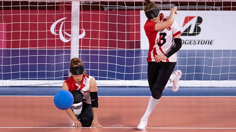Goalball player Sevda Altunoluk stands and throws the ball 