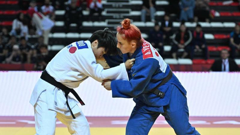 Two female judokas in action