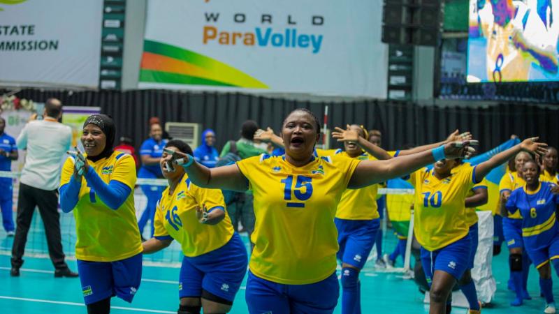 Female sitting volleyball athletes celebrating