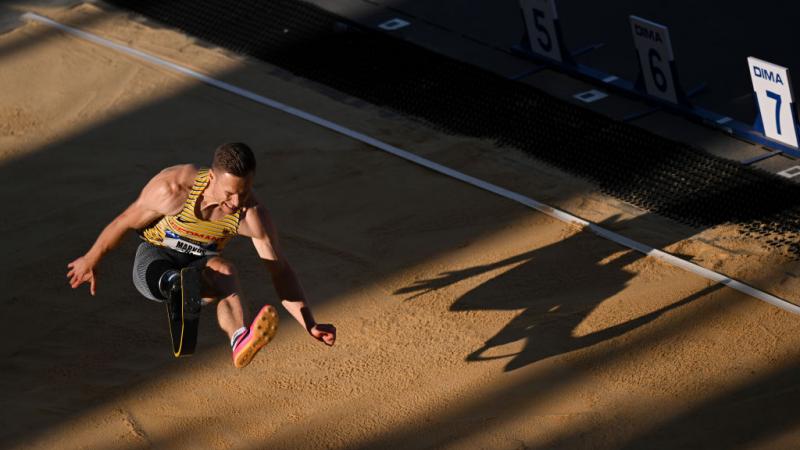 A male long jumper with a prosthetic right leg