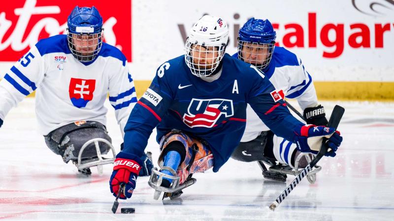 Para Ice hockey players in action. 