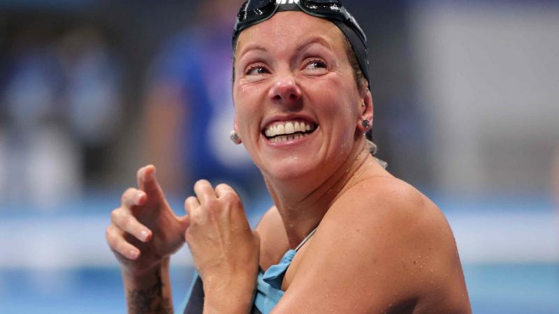 A swimmer reacts after a race