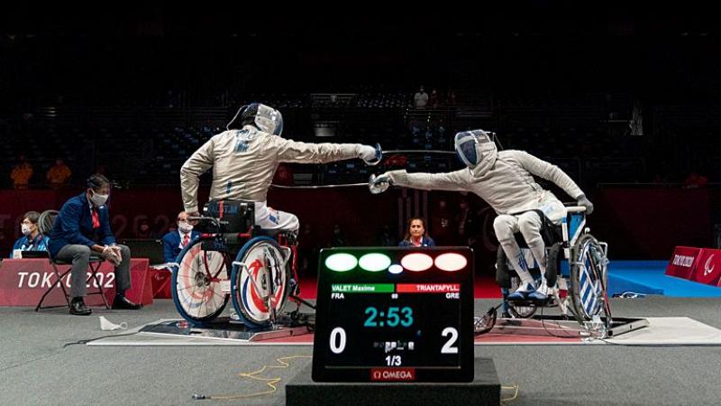 Two wheelchair fencers in action at the Tokyo 2020 Paralympic Games