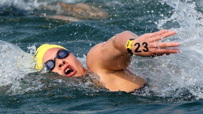 A female swimmer competing in an open water race