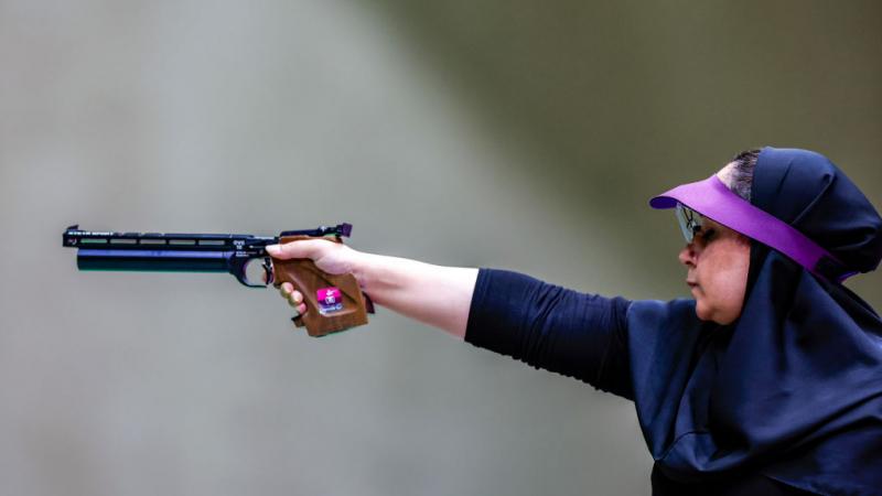 Sareh Javanmardi takes aim in a shooting Para sport competition