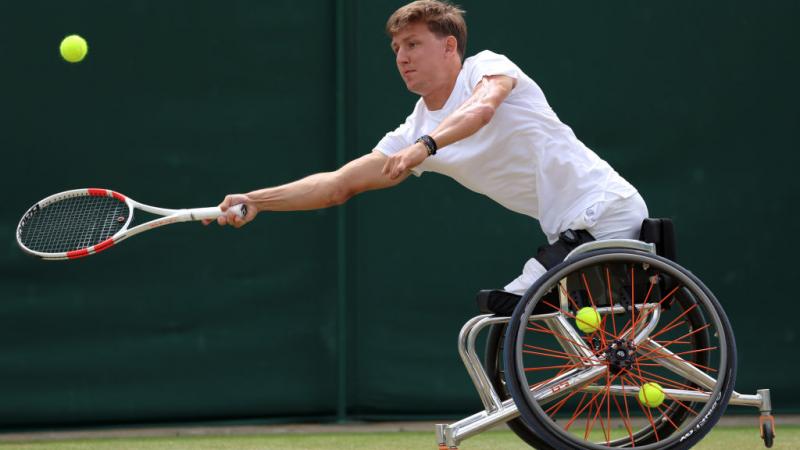 A male wheelchair tennis player in action 