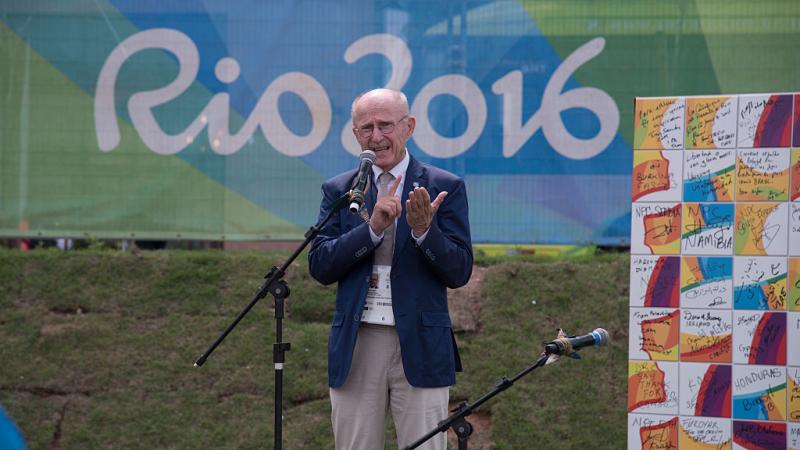 Wilfried Lemke, speaks at the Paralympic Mural Ceremony held at the Rio 2016 Paralympics. He is making a speech in front of a banner that reads Rio 2016.