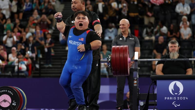 An athlete reacts with ecstacy