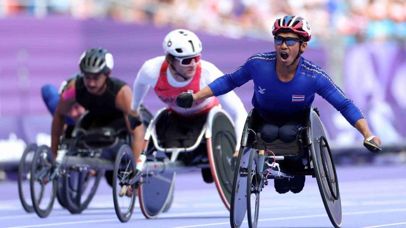 An athlete celebrate after winning the race