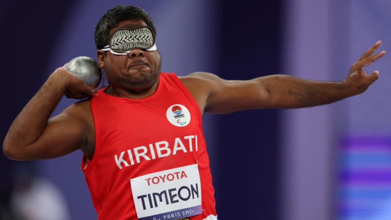 Blindfolded Para athlete Ongiou Timeon gets ready to throw a shot put