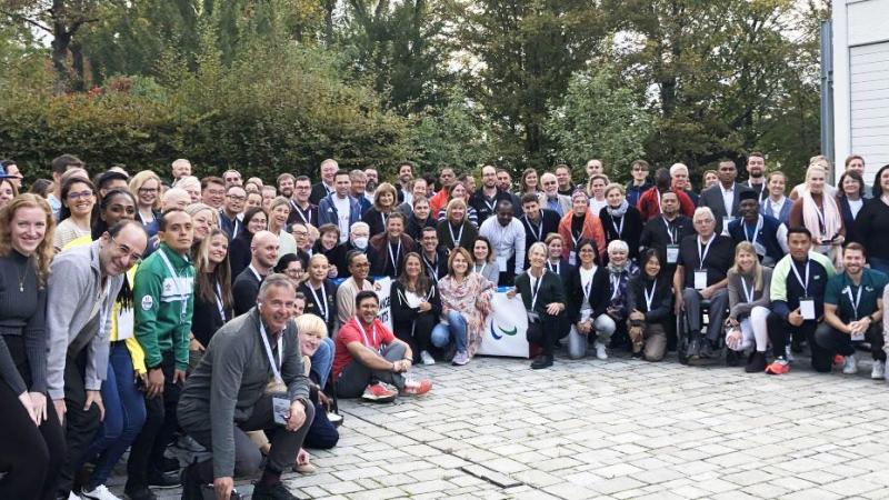 About 100 attendees of the IPC Annual Classification Meeting pose for a group picture 