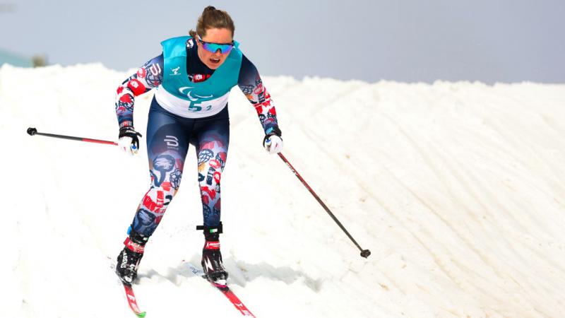 A female Para cross-country skier in action