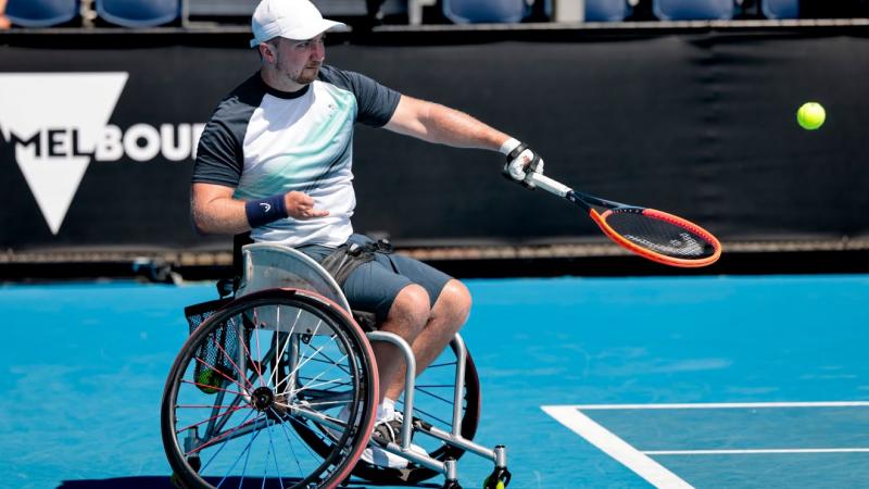 A male wheelchair tennis player in action