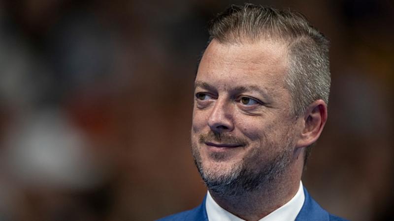 Andrew Parsons, IPC president, looks to his right