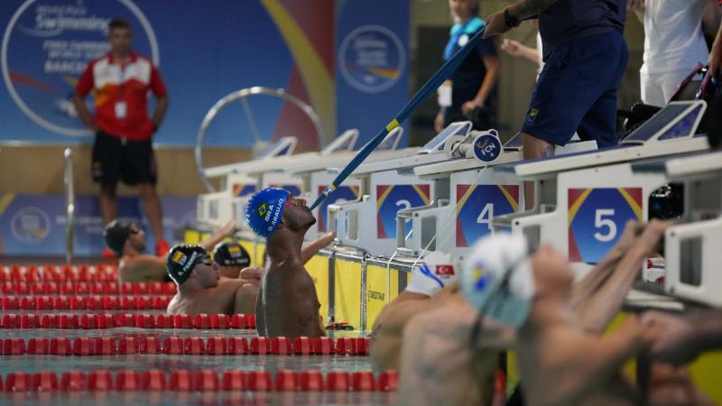 Athletes' line-up in the pool