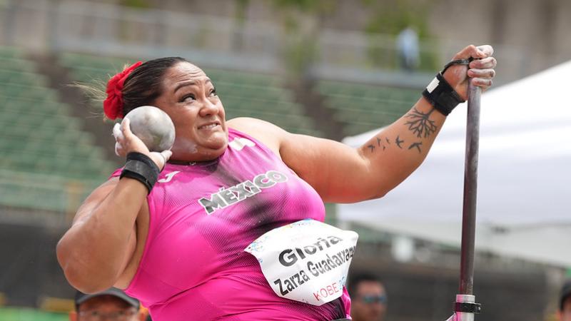 A female seated thrower competing in shot put
