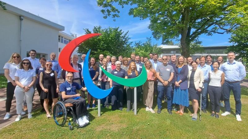 A group of around 50 people in a group picture in front of the IPC headquarters.