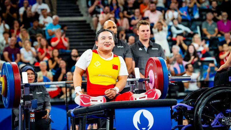 An athlete gestures after a lift