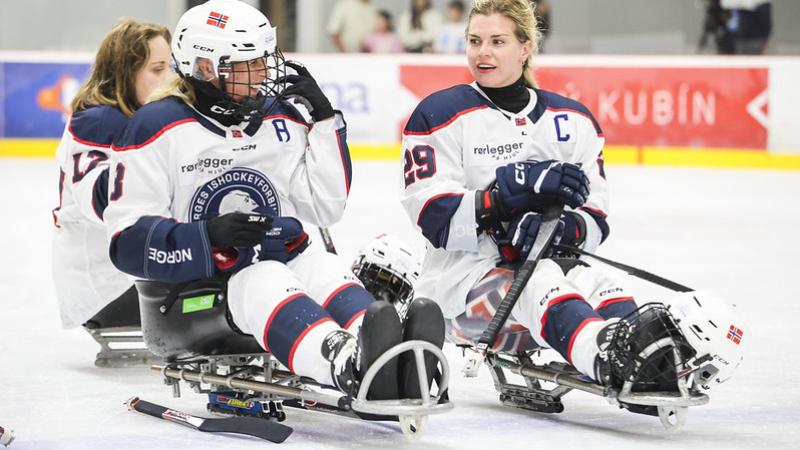 Three Norwegian Para ice hockey players on the ice after a game