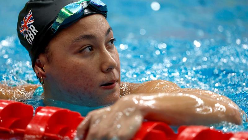 A swimmer gestures after a race