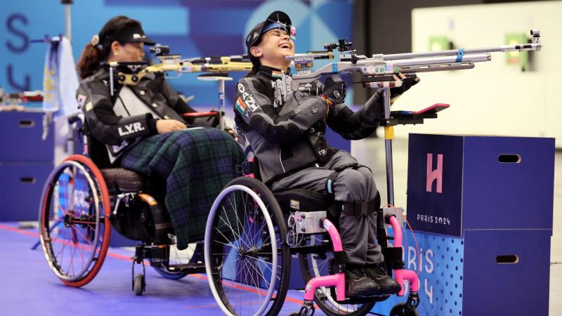 Two female athletes competing in shooting Para sport at the Paris 2024 Paralympics
