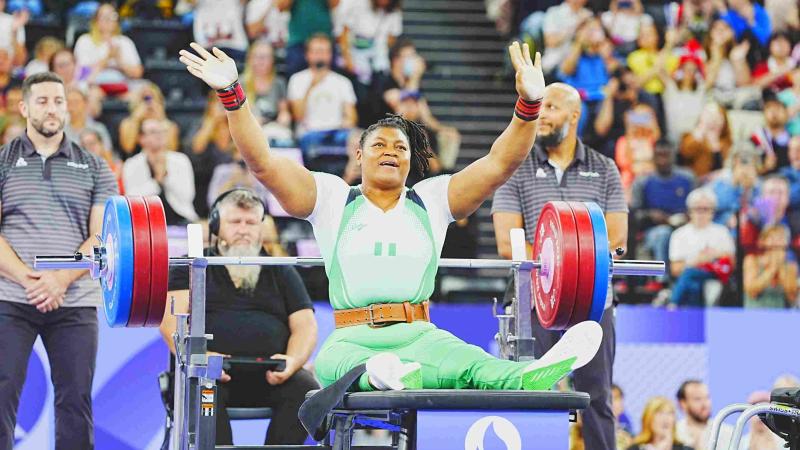 An athlete reacts after a successful lift