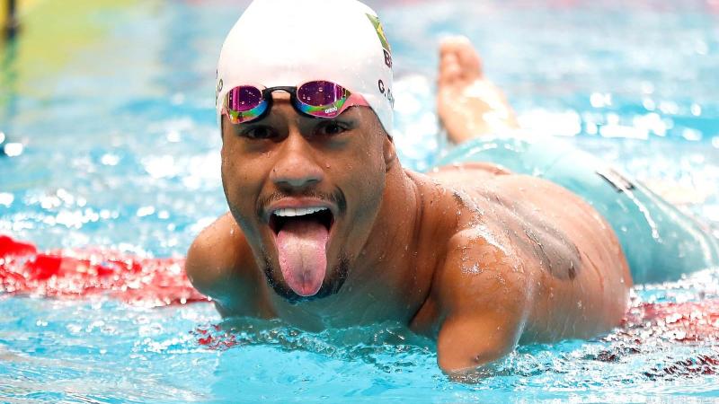 A swimmer gestures after a race