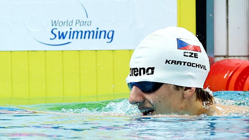 A male blind swimmer in the pool