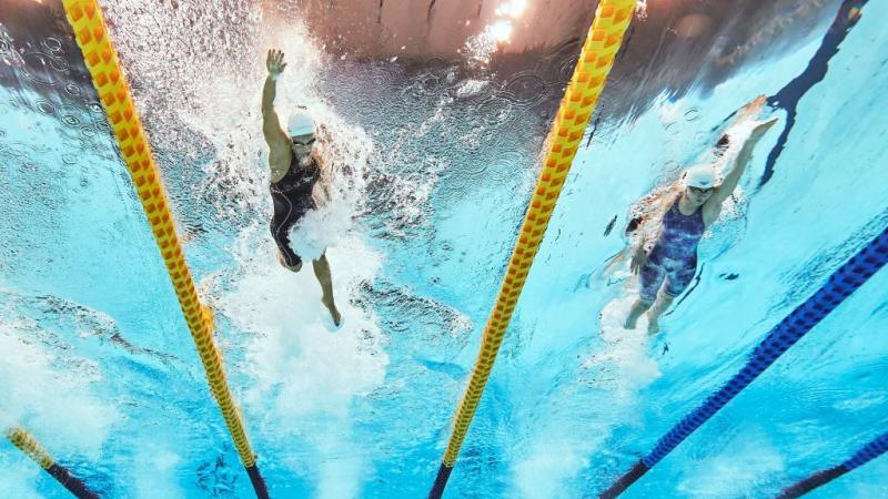 Underwater image of two female swimmers competing