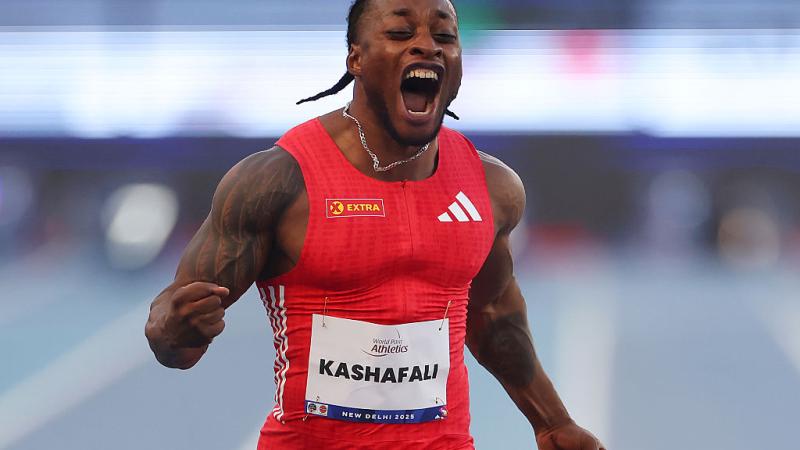 An athlete celebrates in joy