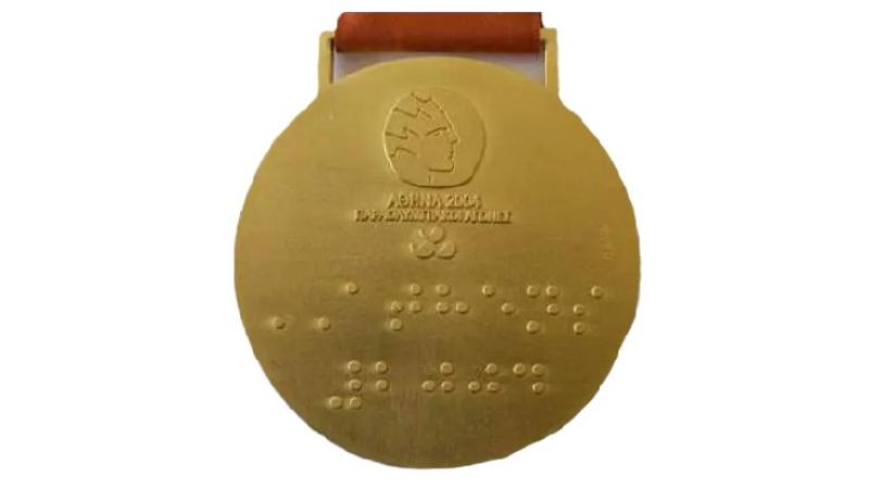 The back of the gold medal from the Athens 2004 Paralympic games.