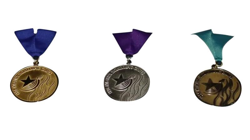 The three gold, silver, and bronze medals from the Atlanta 1996 Paralympic games.
