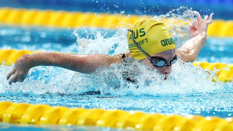 A female Para swimmer competing in a butterfly event