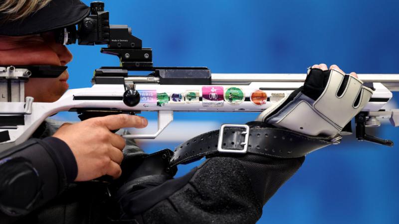 A woman in a rifle shooting event