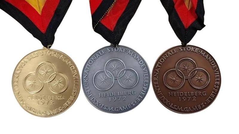 The three gold, silver and bronze medals for the  Heidelberg 1972 Paralympics.