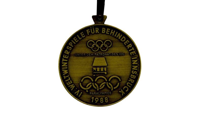 The front of the Innsbruck 1988 Paralympics medal.