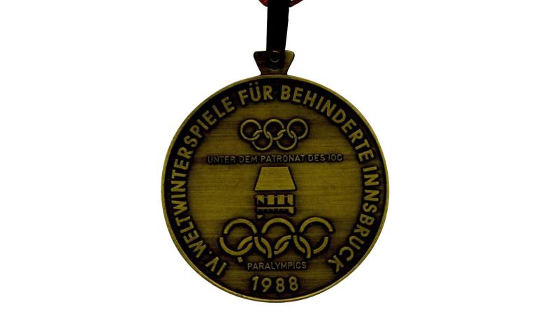 The front of the Innsbruck 1988 Paralympics medal.