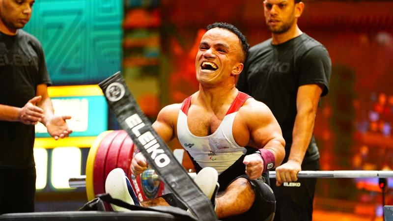 An athlete celebrates in joy