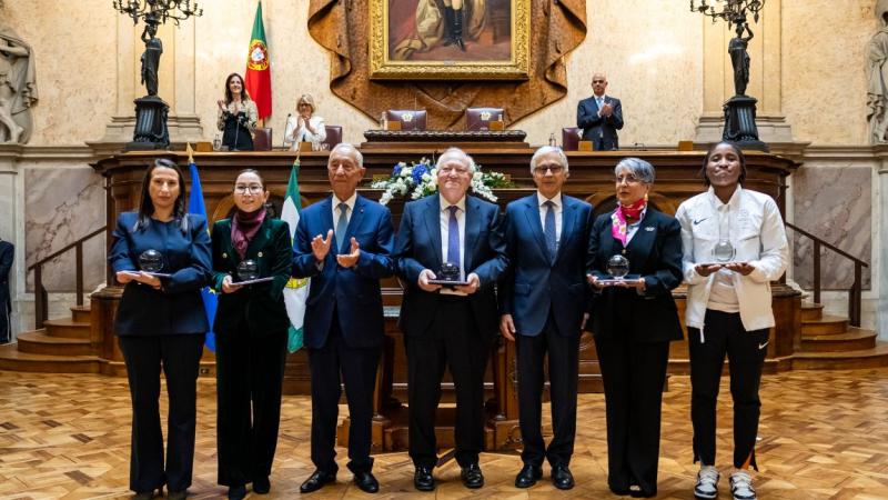 Seven people pose for a group photo