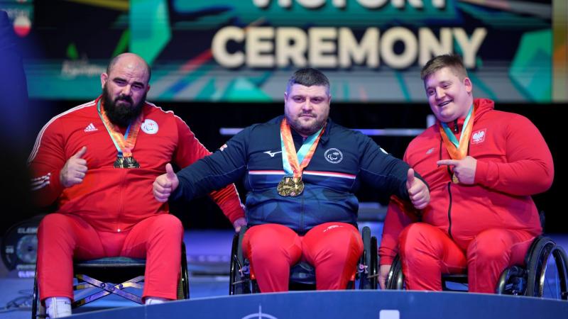 Athletes celebrate on podium