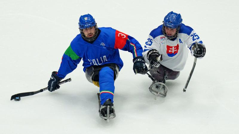 An Italian and a Slovakian Para ice hockey player on ice