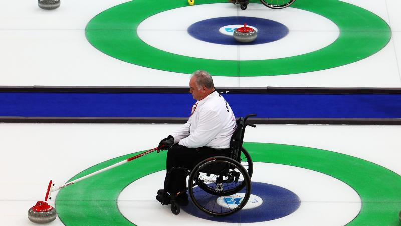 Athletes practicing Wheelchair Curling
