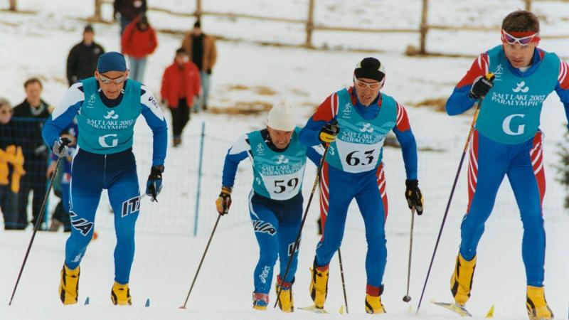 These skiers make their way up the hill during the Men's B2 Short Distance at Soldier Hollow