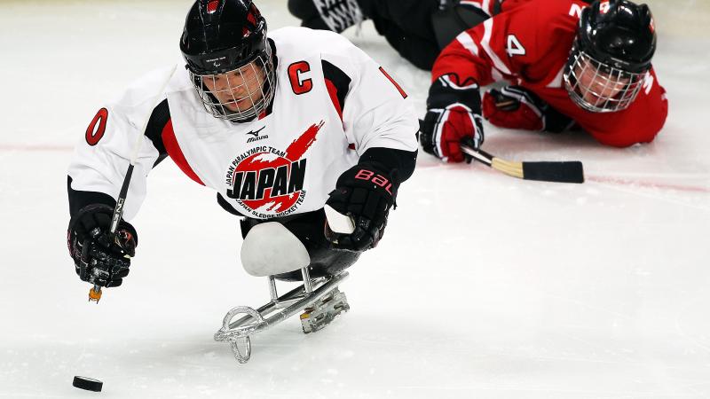 Japanese Ice Sledge Hockey player performing against Canada at Vancouver 2010